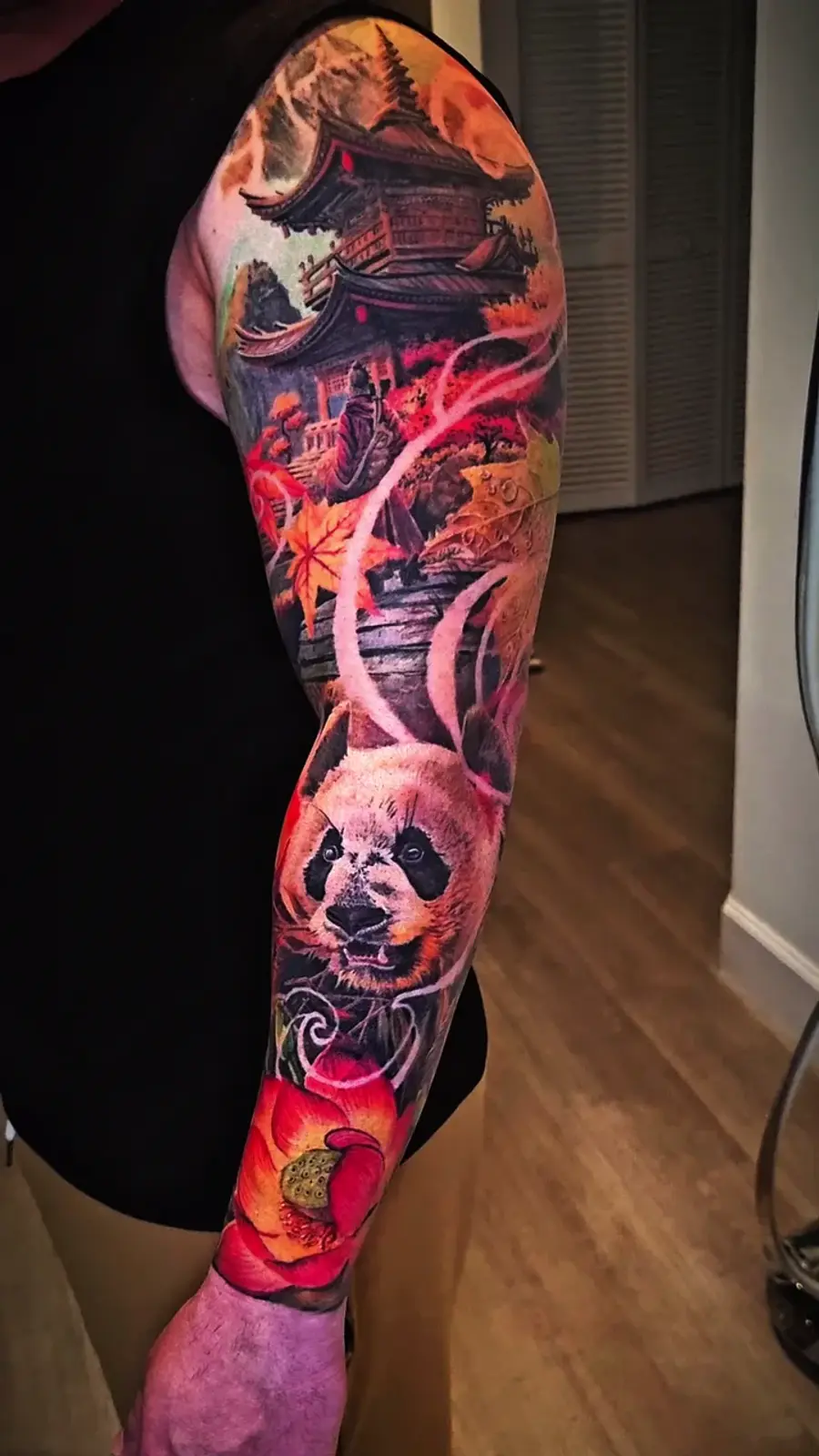Pagoda & Panda — color tattoo on sleeve by Amed Cid, Miami