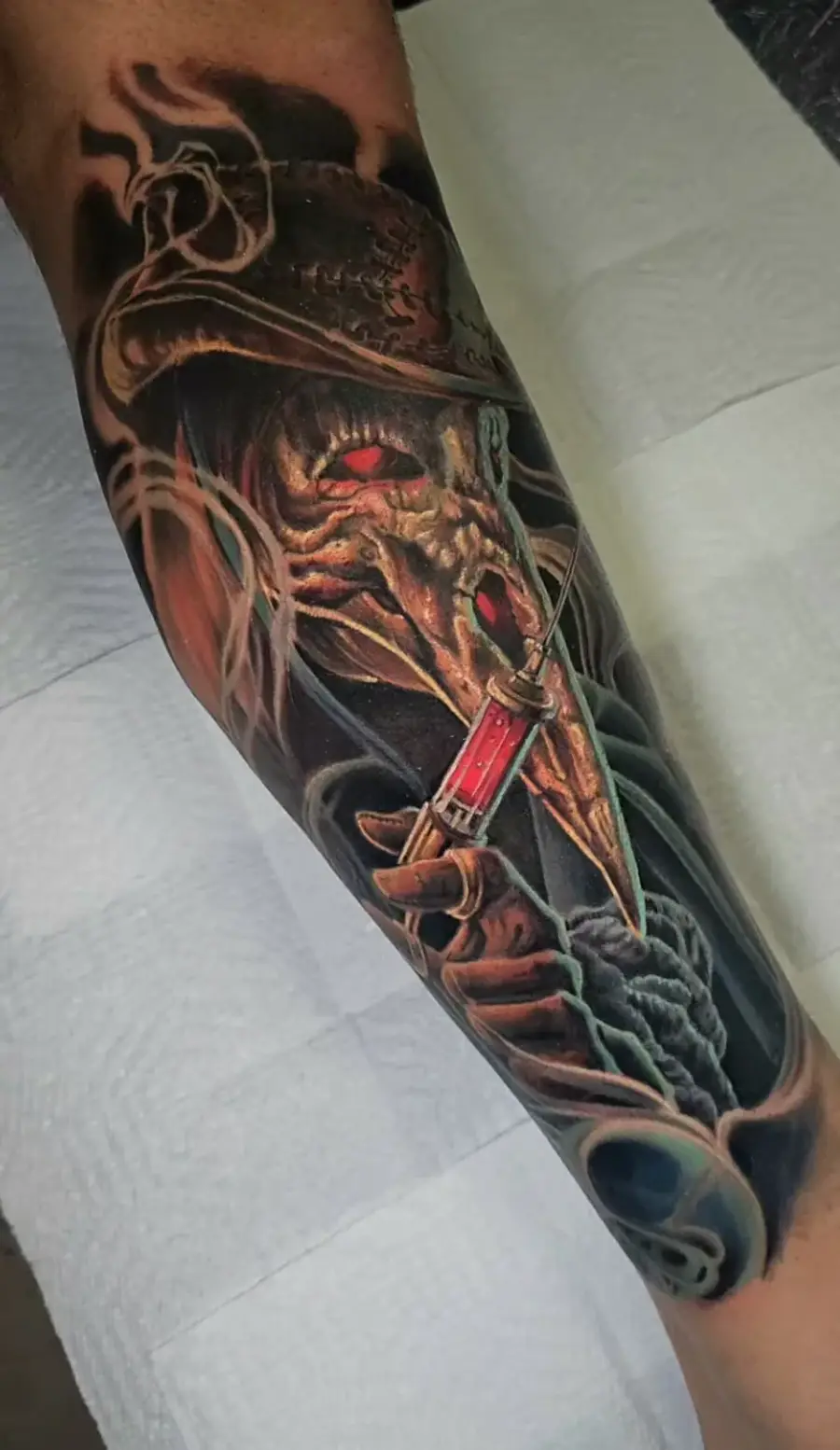 Plague Doctor — color tattoo on forearm by Amed Cid, Miami