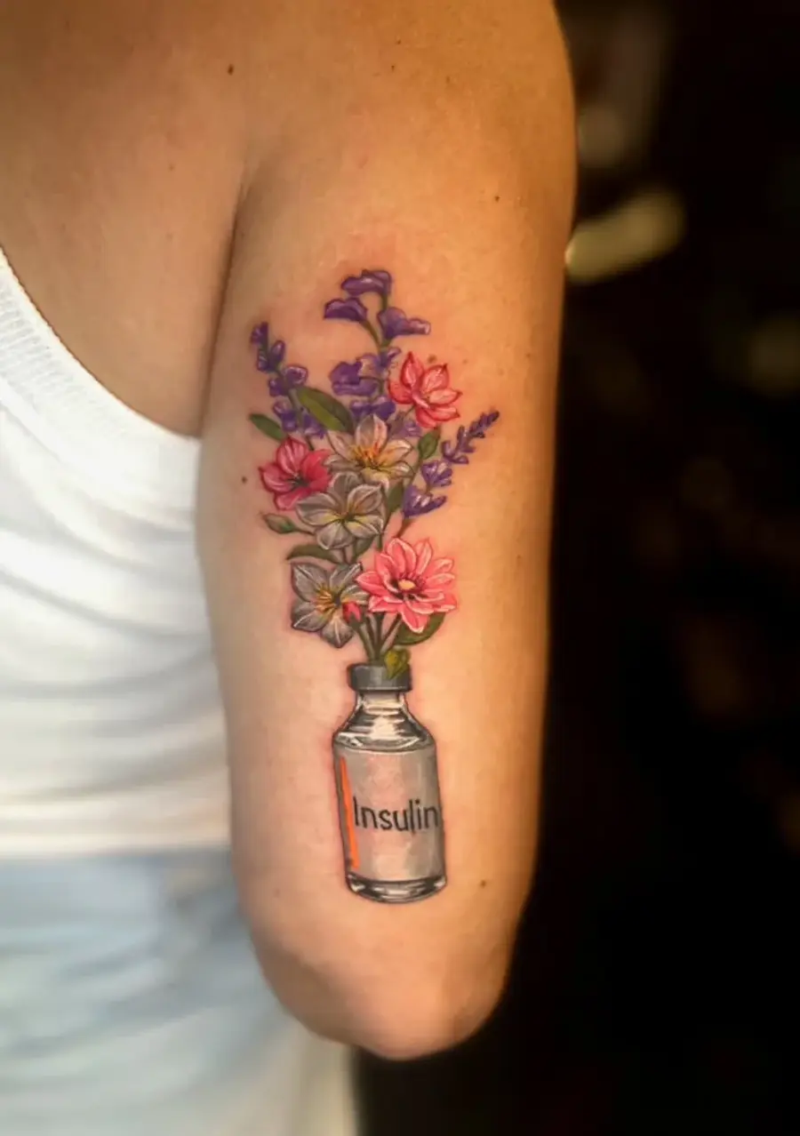 Flowers & Insulin — color tattoo on upper arm by Amed Cid, Miami